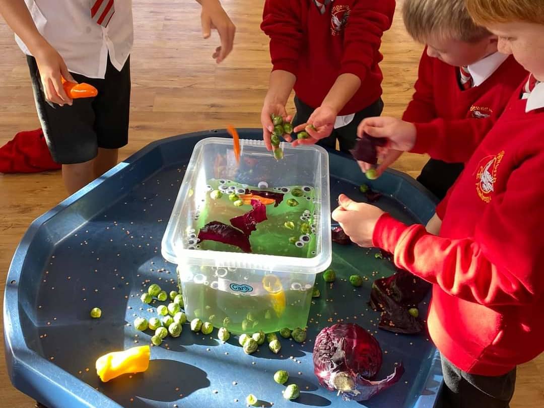 Children playing with vegetables